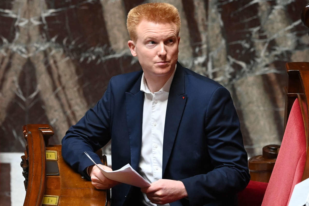 Member of La France Insoumise left wing party Adrien Quatennens gets ready to deliver a speech during a debate on a bill to boost household purchasing power at The National Assembly in Paris, on August 3, 2022. (Photo by Alain JOCARD / AFP)