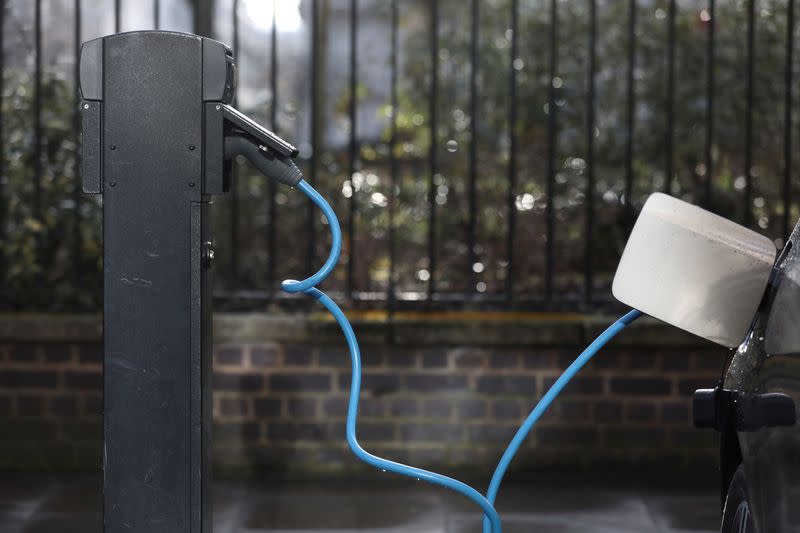 A car is plugged in at a charging point for electric vehicles in London