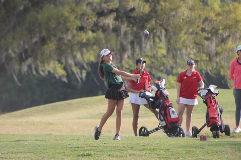 Savannah Country Day's Kate Barber watches her tee shot on the par-3 ninth hole at Bacon Park GC during the Savannah High School City Championship on April 2, 2024.