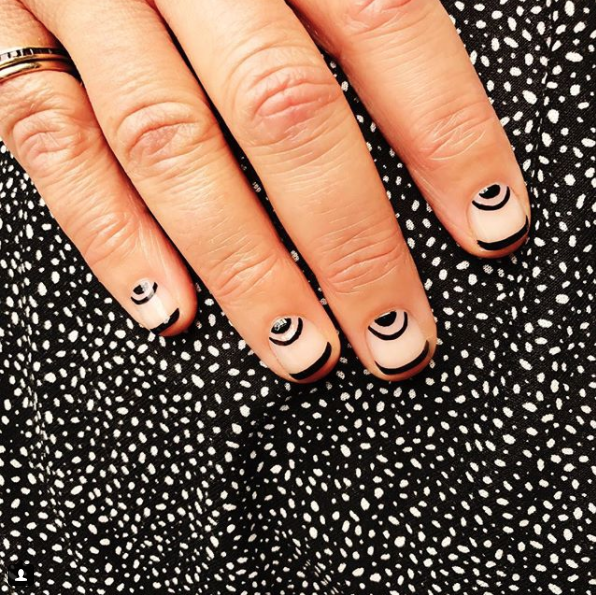 <p>A simple and sweet design that won't conflict with any outfit. Nail artist Miss Pop used CND Vinylux Weekly Polish in "Blackpool" ($10, <a rel="nofollow noopener" href="https://www.amazon.com/CND-Vinylux-Weekly-Polish-Black/dp/B00CNE6TFG?th=1" target="_blank" data-ylk="slk:amazon.com;elm:context_link;itc:0;sec:content-canvas" class="link ">amazon.com</a>) for the half-circles. </p><p><strong>See more at <a rel="nofollow noopener" href="https://www.instagram.com/misspopnails/" target="_blank" data-ylk="slk:Miss Pop Nails;elm:context_link;itc:0;sec:content-canvas" class="link ">Miss Pop Nails</a>.</strong> </p>