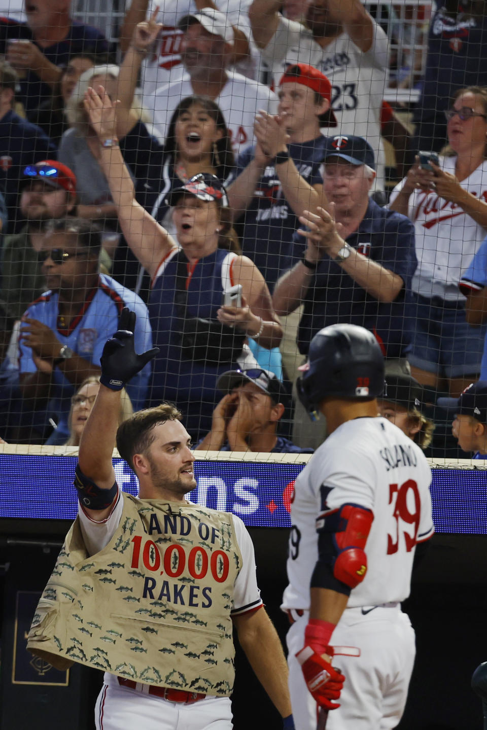 Minnesota Twins' Matt Wallner acknowledges the crowd after hitting a grand slam against the Detroit Tigers during the sixth inning of a baseball game Tuesday, Aug. 15, 2023, in Minneapolis. (AP Photo/Bruce Kluckhohn)