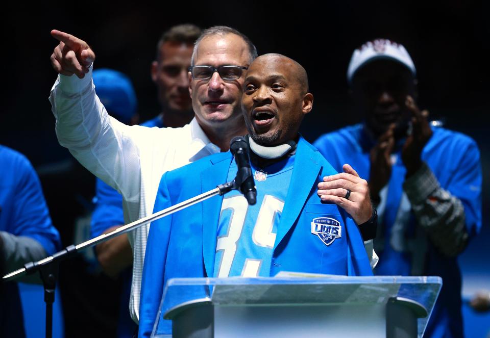 Former Lions safety William White is honored by former linebacker Chris Spielman during his Pride of the Lions celebration during halftime of the Lions' 44-6 loss on Sunday, Oct. 31, 2021, at Ford Field.