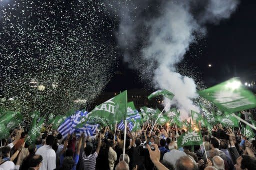 Greek Socialist party supporters wave flags during party leader Evangelos Venizelos' address in front of the Greek Parliament at Syntagma square in Athens, on May 4. Not only Greece but also Europe braced for an election that polls indicate will fail to produce a clear winner, and which markets worry will plunge the eurozone into fresh turmoil