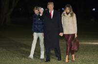 <p>Melania arrived back home at the White House following her Christmas break clad in a pair of burgundy leather trousers. The First Lady matched her trousers with a roll neck top and bag. <em>[Photo: Getty]</em> </p>
