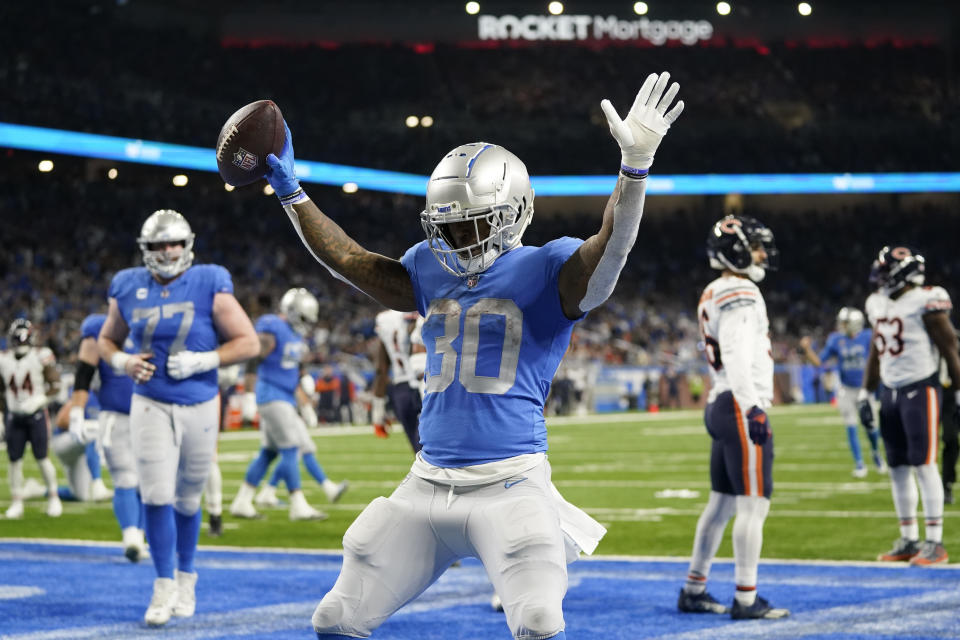 Detroit Lions running back Jamaal Williams reacts after his 2-yard touchdown run during the second half of an NFL football game against the Chicago Bears, Sunday, Jan. 1, 2023, in Detroit. (AP Photo/Paul Sancya)