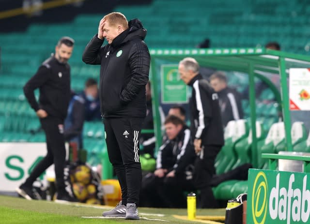 Under-fire Celtic boss Neil Lennon puts his hand to his head during the Scottish League Cup loss to Ross County