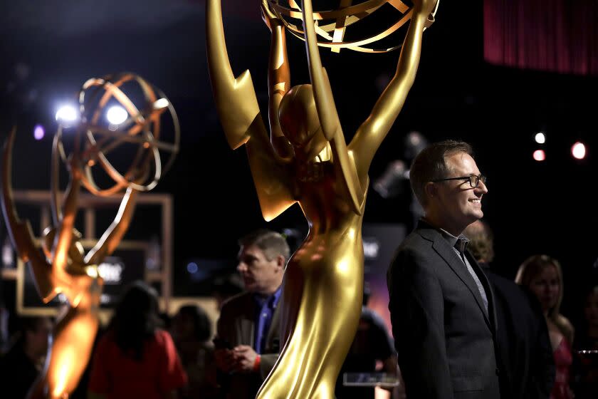 LOS ANGELES-CA-SEPTEMBER 12, 2019: President and COO of the Television Academy Maury McIntyre, at right, poses for photographs at the Press review of the evening of "Brilliance in Motion" aka the Governors Ball that awaits Emmy winners, nominees and industry luminaries at the official Emmys after-parties on Thursday, September 12, 2019. (Christina House / Los Angeles Times)