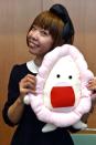 Japanese artist Megumi Igarashi shows off a vagina-shaped mascot, at a press conference in Tokyo in April