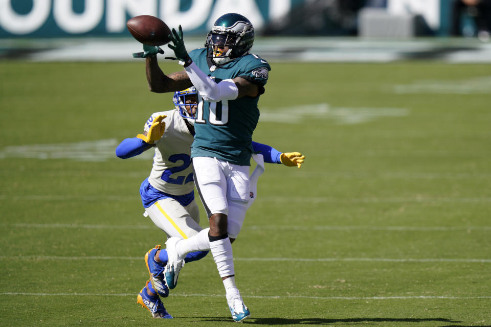 Philadelphia Eagles' DeSean Jackson, right, catches a pass against Los Angeles Rams' Troy Hill during the second half of an NFL football game, Sunday, Sept. 20, 2020, in Philadelphia. (AP Photo/Chris Szagola)