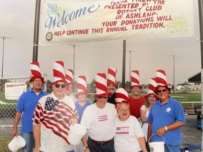 The Rotary July Fourth Fireworks have been a summer tradition for decades. Before heading out to collect donations from the crowd in their firecracker hats are  (front, left to right) are Bruce Bookmyer, Ev DeVaul, Shirley Bookmyer and Dennis Ragle; (rear) Dean DaHinden, Bernard Sargent, Ruth Detrow, Steve Stone, Roger Kramer and Amy Kramer. (circa 2010)