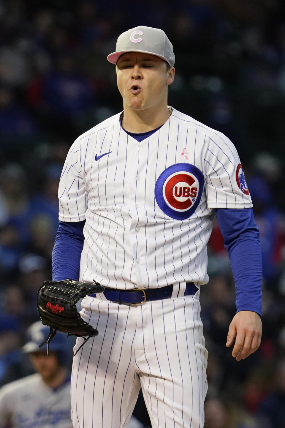 Chicago Cubs starting pitcher Justin Steele reacts after Los Angeles Dodgers' Max Muncy walked to first during the fourth inning of a baseball game in Chicago, Sunday, May 8, 2022. (AP Photo/Nam Y. Huh)