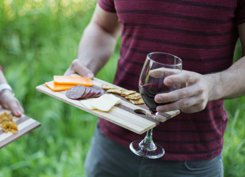 <body><p>Shopping for a do-it-all host or hostess? This rustic appetizer and wine board consolidates two <a rel="nofollow noopener" href=" http://www.bobvila.com/slideshow/10-extras-to-diy-for-your-kitchen-48709?bv=yahoo" target="_blank" data-ylk="slk:kitchen accoutrements;elm:context_link;itc:0;sec:content-canvas" class="link ">kitchen accoutrements</a> into a convenient and elegant approach to serving snacks and drinks on-the-go. And by pairing easily with any stemmed wine glass, it also frees up a hand for multi-tasking. <em>Available at <a rel="nofollow noopener" href=" http://dropandcatch.com/collections/shop/products/appetizer-wine-board" target="_blank" data-ylk="slk:Drop and Catch;elm:context_link;itc:0;sec:content-canvas" class="link ">Drop and Catch</a>; $20.</em> </p></body>