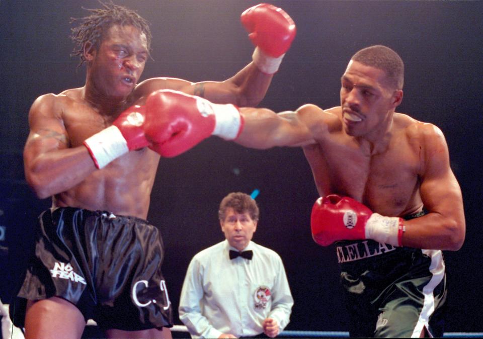 LONDON - FEBRUARY 25,1995: Nigel Benn (L) throws a left hook against Gerald McClellan during the fight at New London Arena on February 25, 1995 in Millwall, London, United Kingdom. Nigel Benn won the WBC super middleweight title.(Photo by: The Ring Magazine/Getty Images) 