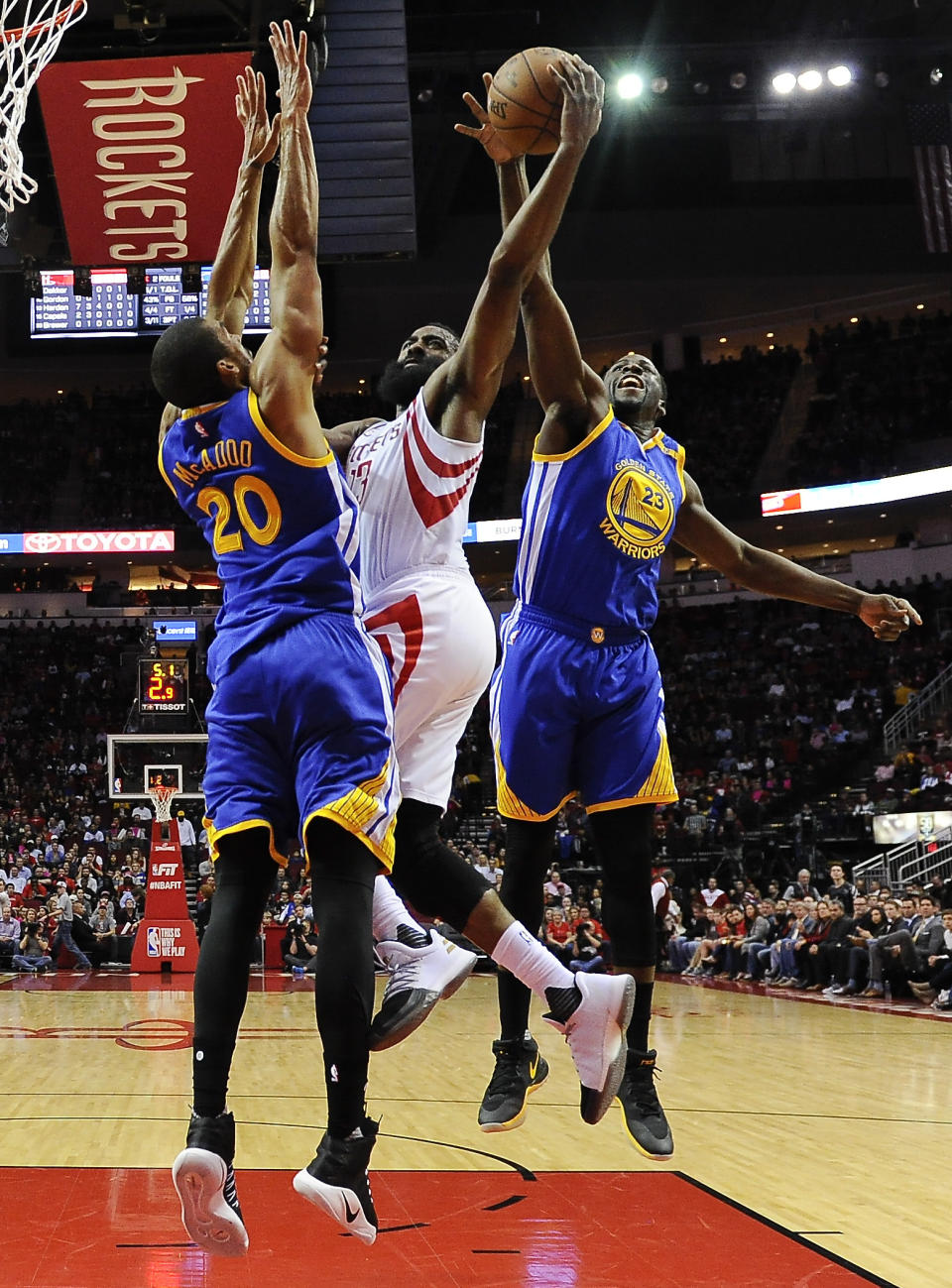 Golden State Warriors forward Draymond Green (23) blocks the shot of Houston Rockets guard James Harden, center, as forward James Michael McAdooin defends during the first half of an NBA basketball game, Friday, Jan. 20, 2017, in Houston. (AP Photo/Eric Christian Smith)