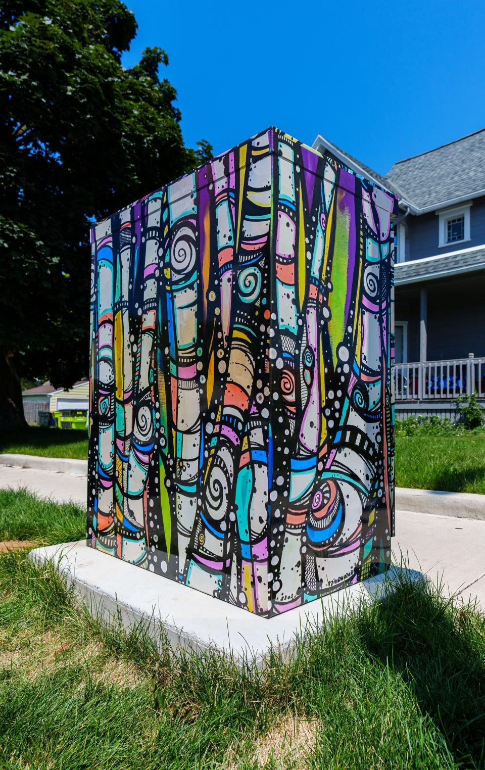 A utility box at 76th & Becher is wrapped with art by Shelly Rosenquist as seen on Friday, July 21, 2023. The box is one of 11 selected for the City of West Allis public art utility box program.