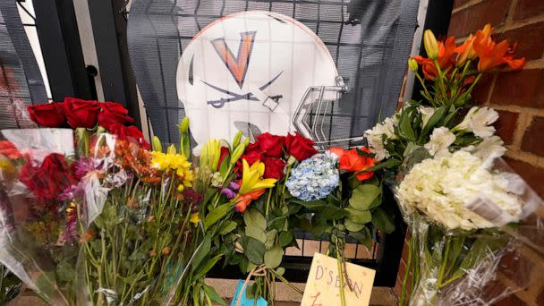 PHOTO: Memorial flowers and notes line walkway at Scott Stadium after three football players were killed in a shooting on the grounds of the University of Virginia, on Nov. 15, 2022, in Charlottesville. Va. (Steve Helber/AP)