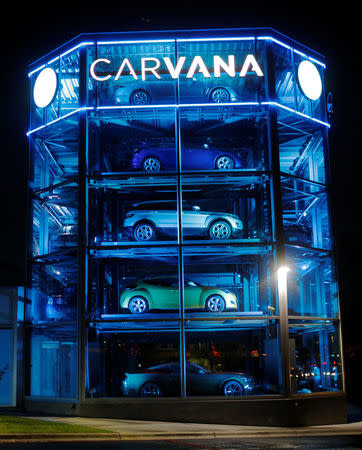 Vehicles are displayed at a Carvana dealership, which allows customers to buy a used car online and have it delivered or pick it up from an automated-tower, in Austin, Texas, U.S., March 9, 2017. REUTERS/Brian Snyder