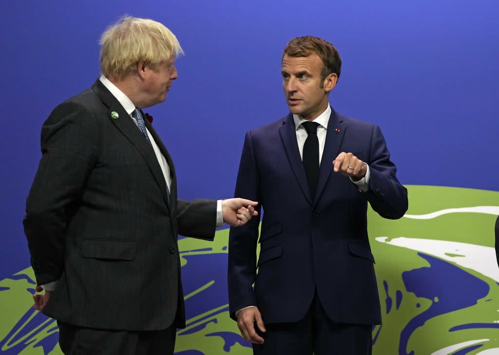 Prime Minister Boris Johnson (left) greets French President Emmanuel Macron at the Cop26 summit in Glasgow (Alastair Grant/PA) (PA Wire)