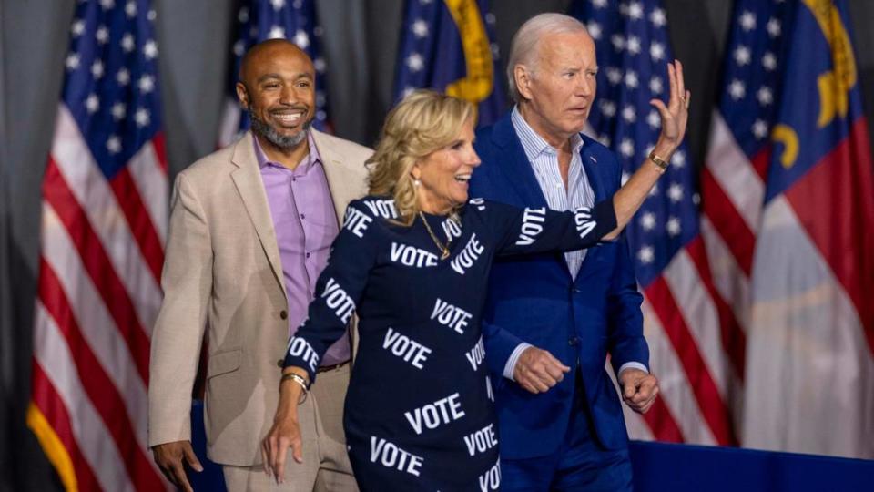 Public school educator Eric Fitts, First Lady Jill Biden and President Joe Biden take the stage during a campaign event at the Jim Graham building at the North Carolina State Fairgrounds in Raleigh on Friday June 28, 2024. Biden debated former President Trump in Atlanta Georgia the previous night.