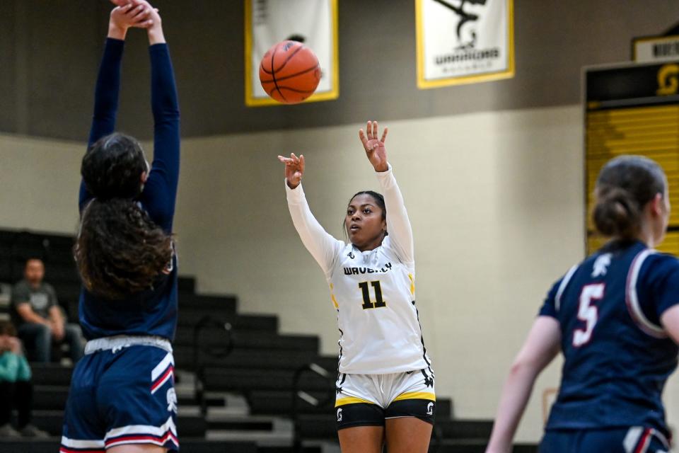 Waverly's Cherie McCants makes a 3-pointer against East Lansing during the third quarter on Monday, Feb. 27, 2023, at Waverly High School.