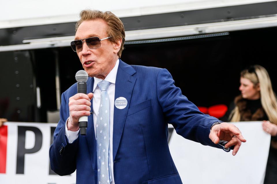 Republican gubernatorial candidate Perry Johnson speaks before a Save America rally at the Michigan Stars Sports Center in Washington Township on April 2, 2022.