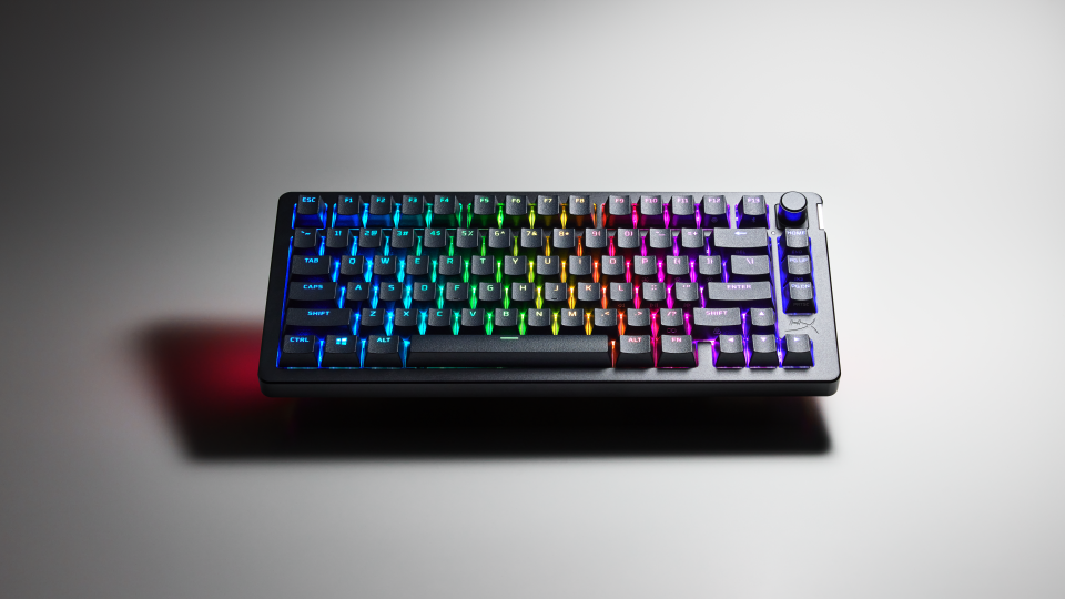 Product image of the HyperX Alloy Rise 75 keyboard. It sits on a table with dramatic shadows.