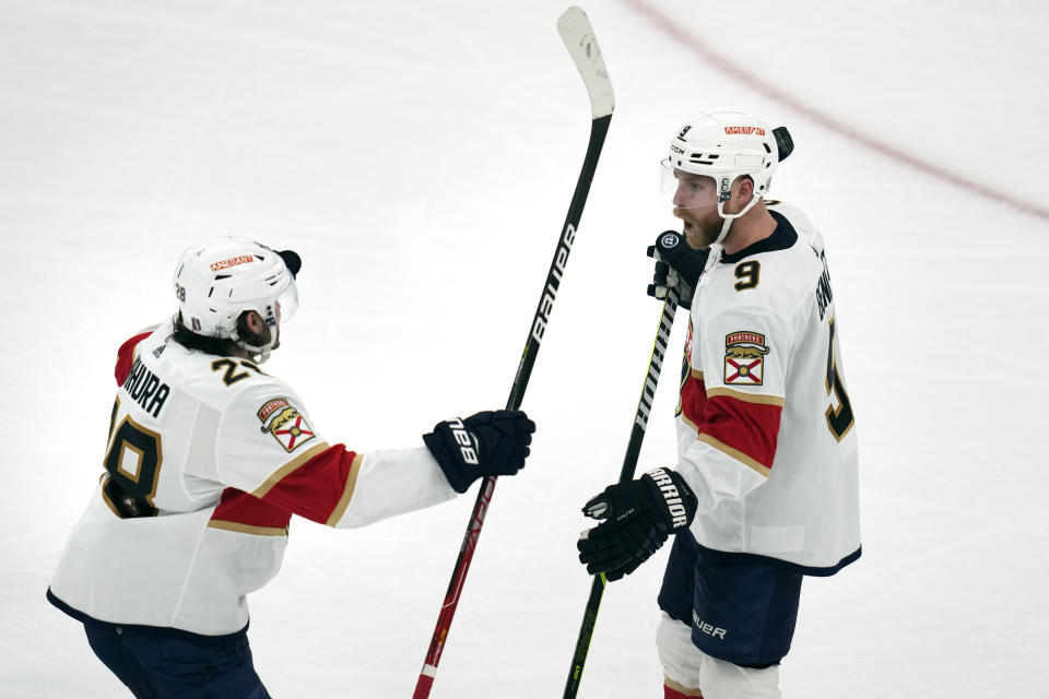 Florida Panthers center Sam Bennett (9) is congratulated by defenseman Josh Mahura, left, after his goal off Boston Bruins goaltender Linus Ullmark during the second period of Game 5 in the first round of the NHL hockey playoffs, Wednesday, April 26, 2023, in Boston. (AP Photo/Charles Krupa)