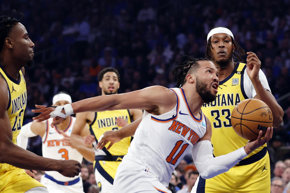 NEW YORK, NEW YORK - MAY 06: Jalen Brunson #11 of the New York Knicks drives past Aaron Nesmith #23 and Myles Turner #33 of the Indiana Pacers during the first quarter in Game One of the Eastern Conference Second Round Playoffs at Madison Square Garden on May 06, 2024 in New York City. NOTE TO USER: User expressly acknowledges and agrees that, by downloading and or using this photograph, User is consenting to the terms and conditions of the Getty Images License Agreement. (Photo by Sarah Stier/Getty Images)