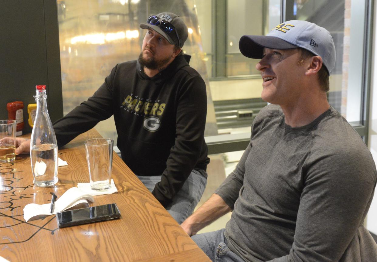 Josh Erskine Delavan, left, and Jason Schmieden of Elkhorn watch as the Green Bay Packers make their first pick of the 2024 NFL Draft on Thursday, April 24, at 1919 Kitchen & Tap at Lambeau Field in Green Bay, Wisconsin.