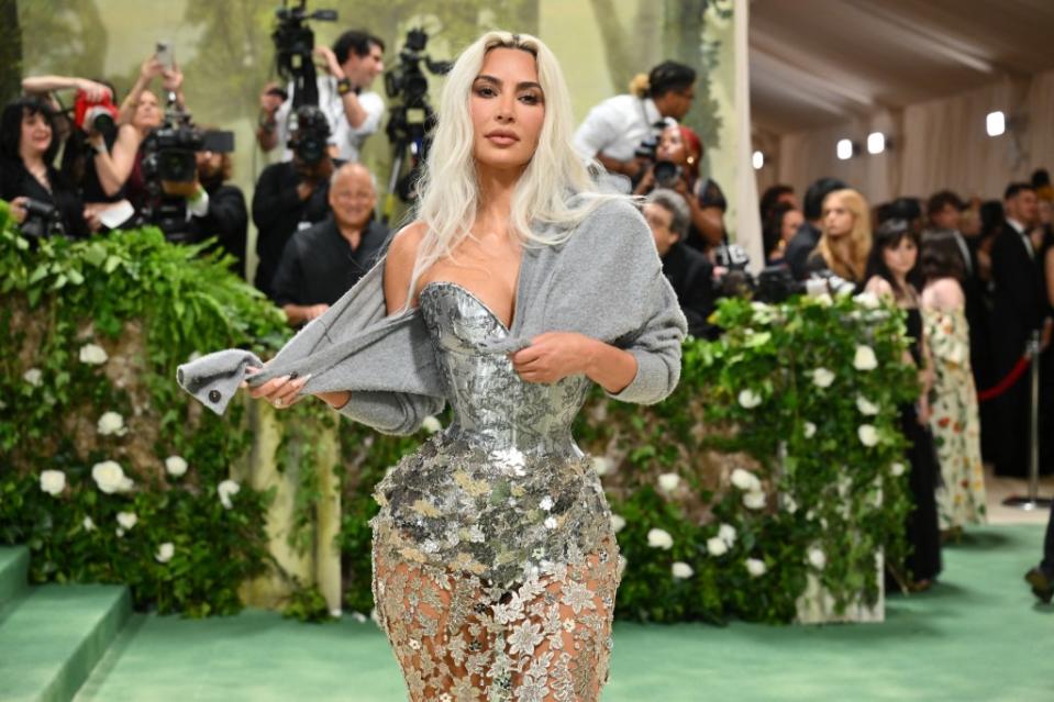 Kim Kardashian was trolled for her “raggedy” cardigan at the event. AFP via Getty Images