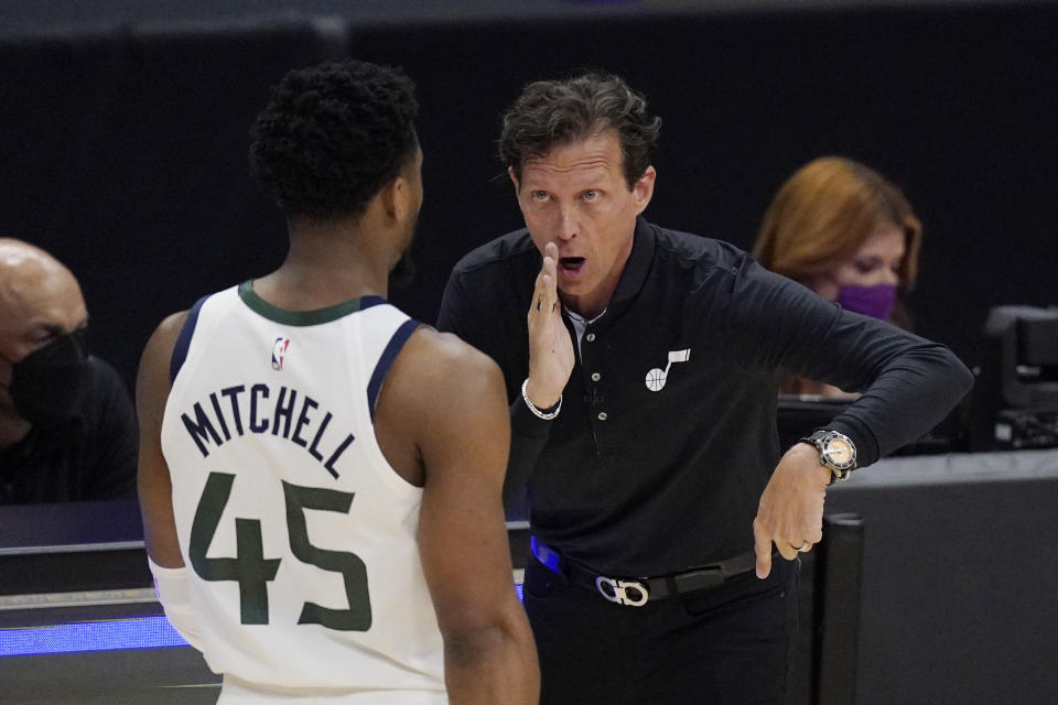 Utah Jazz guard Donovan Mitchell, left, talks with head coach Quin Snyder during the second half in Game 6 of a second-round NBA basketball playoff series against the Los Angeles Clippers Friday, June 18, 2021, in Los Angeles. (AP Photo/Mark J. Terrill)