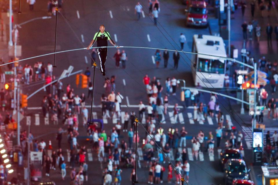 A brother and sister tightrope act entertained thousands of tense onlookers in New York last night as they crossed Times Square on a high wire strung 25 storeys above the ground.Nik and Lijana Wallenda of the of the “Flying Wallendas” stunt troupe, walked from opposite ends of the 1,300 foot long wire, which stretched from 42nd Street to 47th Street, and crossed halfway.The stunt, which took 36 minutes to complete, was Lijana’s first high wire performance since a disastrous 2017 fall when she broke nearly every bone in her face.The siblings walked from opposite ends of the 1,300-foot wire suspended between the towers, crossing each other in the middle, where Lijana sat on the wire and let her brother step over her.Both then continued to the opposite side.Their latest daredevil stunt was streamed live on US network ABC and watched by thousands of spectators from below.The two were wearing tethered safety harnesses required by the city in case they fell.The Wallenda family has been a star tightrope-walking troupe for generations, tracing their roots to 1780 in Austria-Hungary, when their ancestors travelled as a band of acrobats, aerialists, jugglers, animal trainers, and trapeze artists.They never use nets in live shows or in rehearsals.In 1978, 73-year-old Karl Wallenda fell to his death from a high wire strung between two buildings in Puerto Rico.In 1962, Karl Wallenda's nephew and son-in-law died, and his son was paralysed, after a seven-person pyramid collapsed during a performance.Lijana's fall happened during an attempt to break a Guinness world record with an eight-person pyramid.Nik's high-wire walks above Niagara Falls, the Chicago skyline, and the Little Colorado River Gorge near Grand Canyon National Park were broadcast on national television.