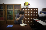 <p>A staff member at the Grand People’s Study House looks for a specific publication on July 24, 2017, in Pyongyang, North Korea. The building is situated on Kim Il Sung Square and serves as the central library where North Koreans also go to for language classes such as English, Chinese German and Japanese. (Photo: Wong Maye-E/AP) </p>