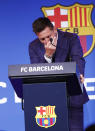 Lionel Messi cries at the start of a press conference at the Camp Nou stadium in Barcelona, Spain, Sunday, Aug. 8, 2021. FC Barcelona had previously announced the negotiations with Lionel Messi had ended and that Messi would be leaving the club. (AP Photo/Joan Monfort)