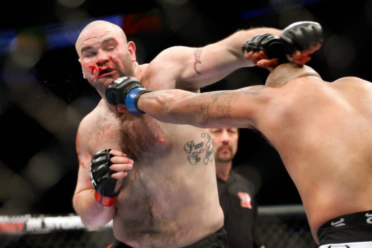 Tim Hague (L), shown during a 2010 UFC fight with Joey Beltran, died Sunday in Edmonton as a result of injuries he suffered in a boxing match. (Getty Images)