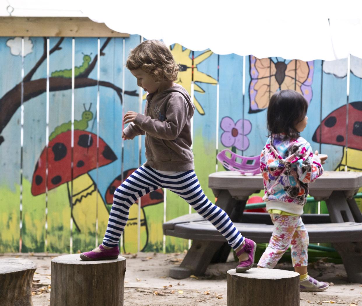 TORONTO, ON - SEPTEMBER 30:  Children enrolled in the University of Toronto Co-op Day Care play outside Tuesday September 30, 2014 before Toronto mayoral candidate Olivia Chow released her child care platform.        (Tara Walton/Toronto Star via Getty Images)