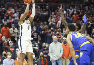 Virginia forward Jayden Gardner (1) shoots the winning basket next to Pittsburgh guard William Jeffress (24) during an NCAA college basketball game in Charlottesville, Va., Friday, Dec. 3, 2021. (AP Photo/Andrew Shurtleff)