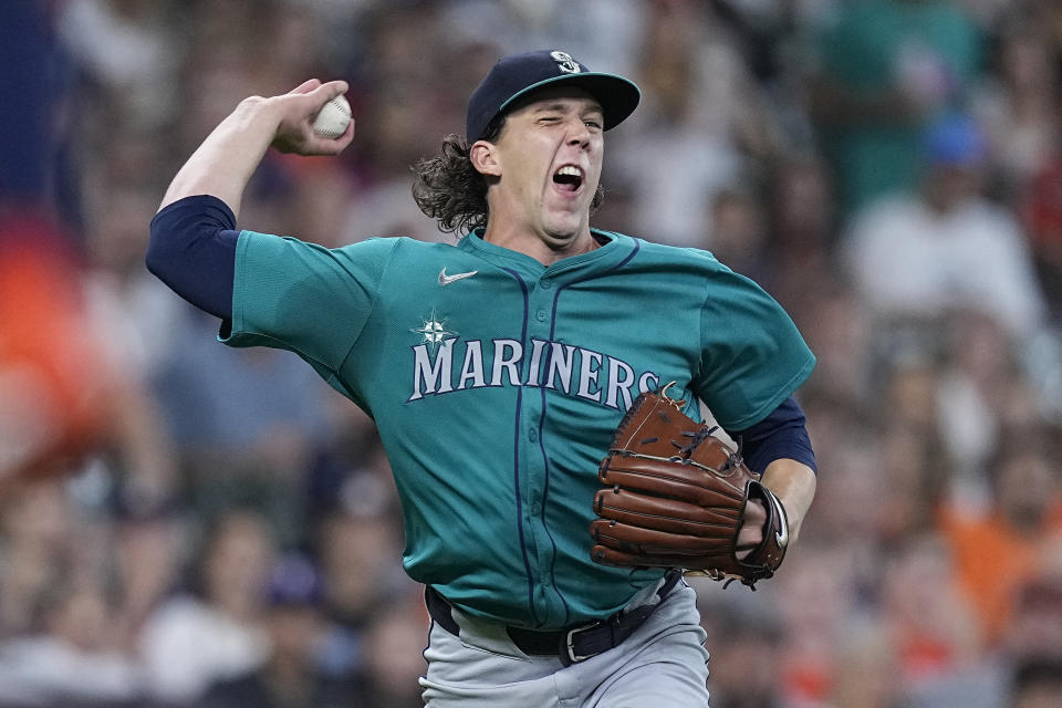 Seattle Mariners starting pitcher Logan Gilbert fields an infield hit by Houston Astros' Yordan Alvarez during the first inning of a baseball game Saturday, May 4, 2024, in Houston. (AP Photo/Kevin M. Cox)