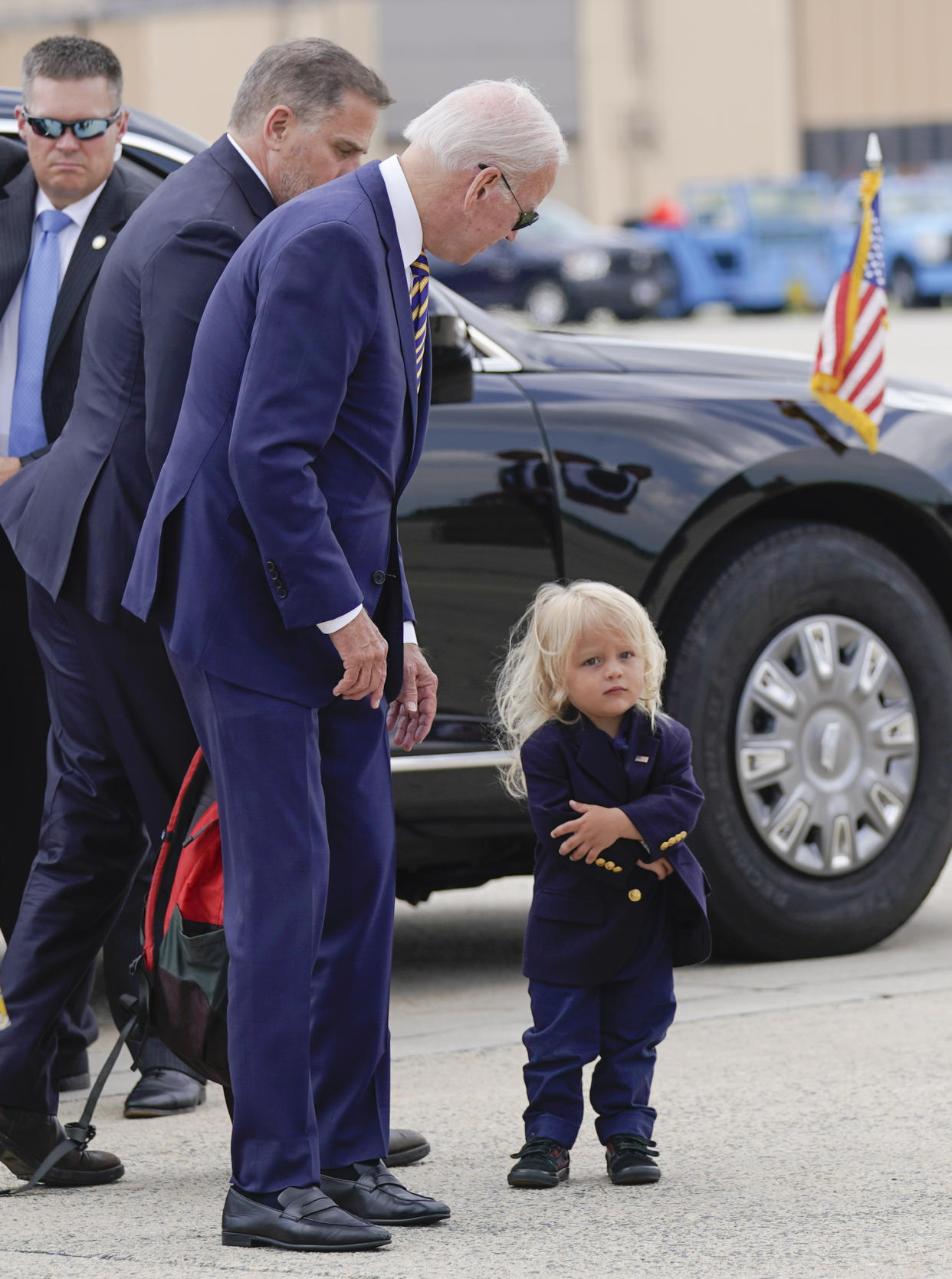 President Joe Biden looks at his grandson Beau Biden as he walks to board Air Force One with his son Hunter Biden at Andrews Air Force Base, Md., Wednesday, Aug. 10, 2022. The President is traveling to Kiawah Island, S.C., for vacation. (AP Photo/Manuel Balce Ceneta)