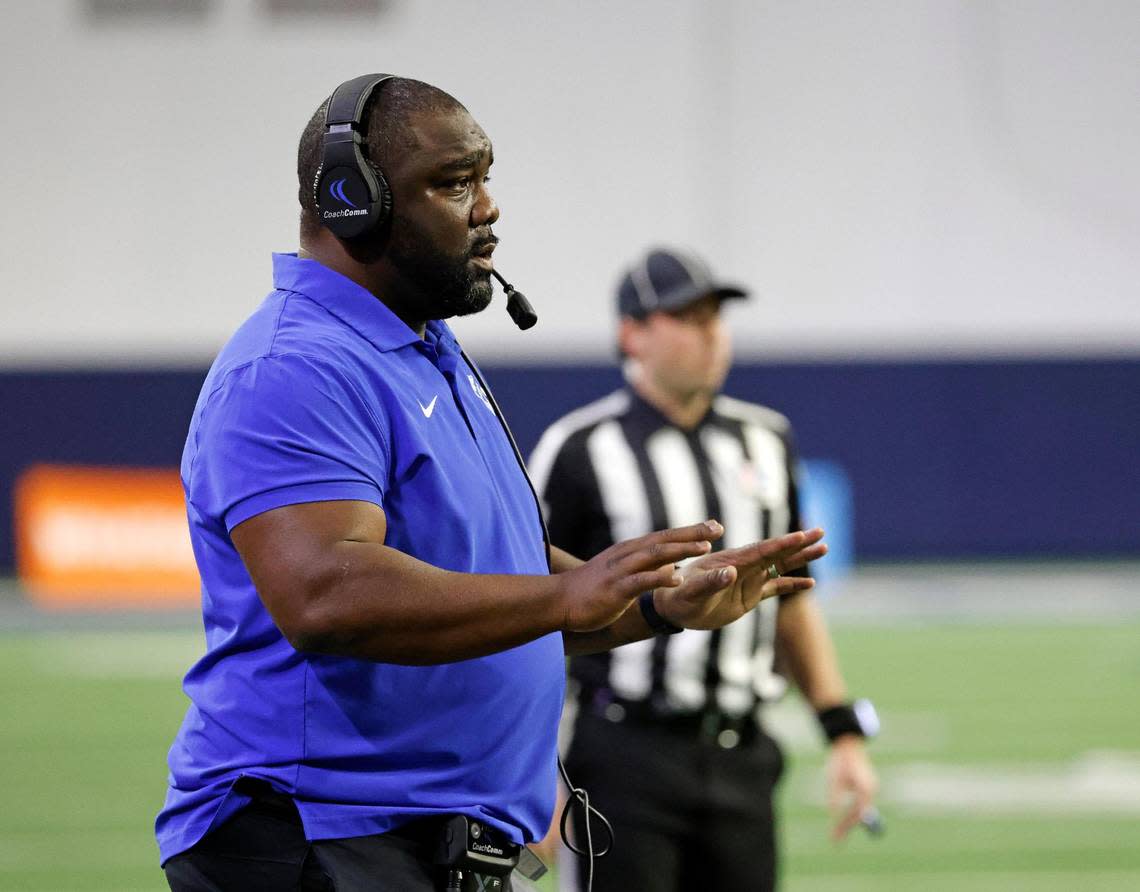 North Crowley head coach Ray Gates attempts to calm down the defense in the first half of a UIL Class 6A Division 1 football regional-round playoff game at The Ford Center in Frisco, Texas, Saturday, Oct. 25, 2023.