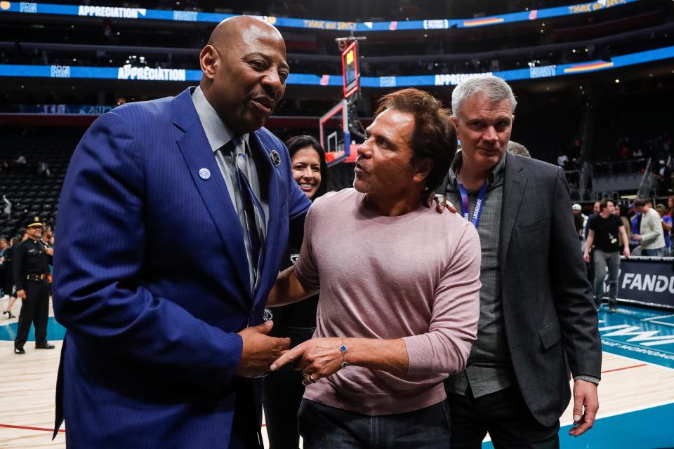 Detroit Pistons owner Tom Gores talks to Earl Cureton after the Pistons lost 123-108 to the Brooklyn Nets at Little Caesars Arena in Detroit on Wednesday,  April 5, 2023.