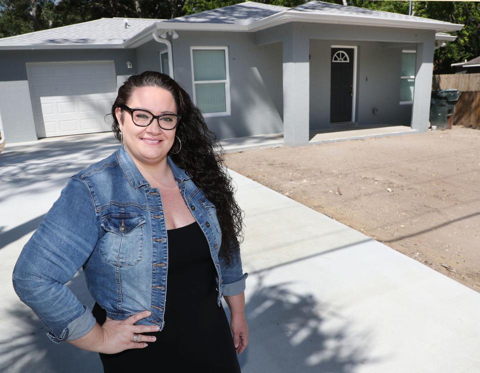 Samantha Hickerson stands in the driveway of her new Habitat For Humanity home in Daytona Beach last year.