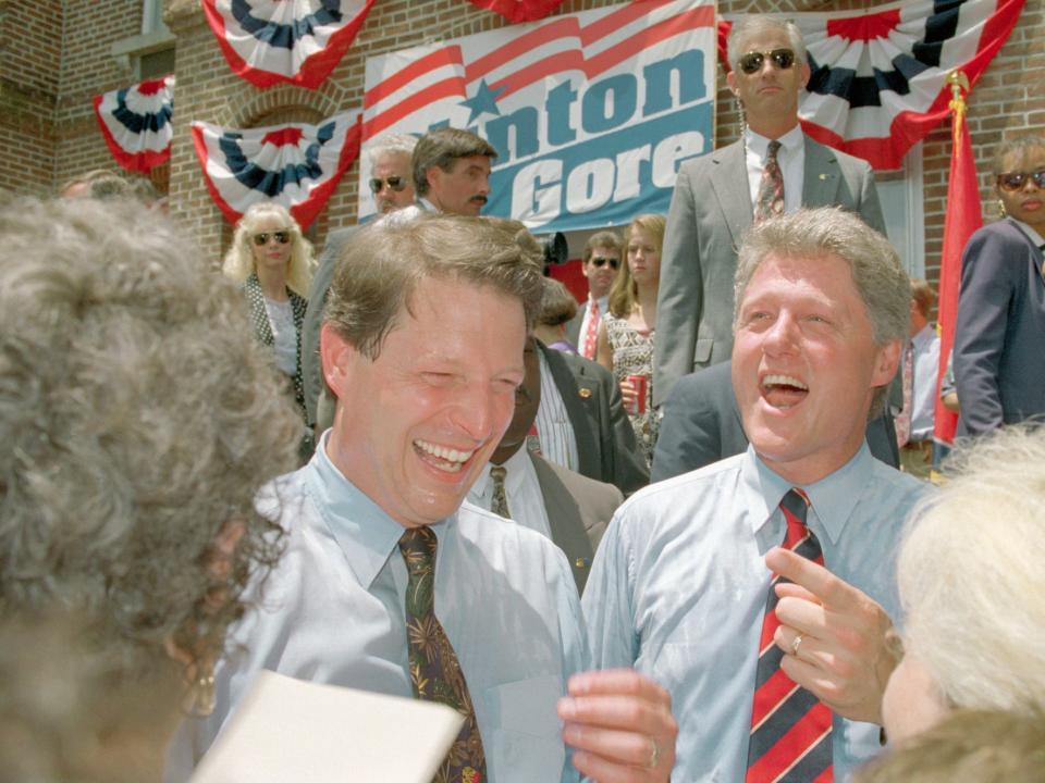 Al Gore and Bill Clinton laughing after a rally during the 1992 presidential campaign.