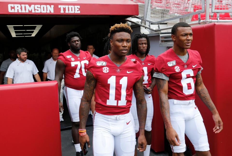 Receivers Henry Ruggs III and DeVonta Smith enter the stadium for media day Saturday, August 3, 2019 in Bryant-Denny Stadium. [Staff Photo/Gary Cosby Jr.]