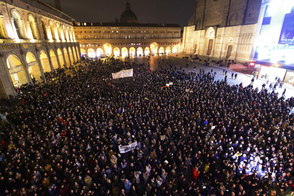 People gather to show support for Patrick George Zaki, in Bologna, Italy, Monday, Feb. 17, 2020. Police detained Patrick George Zaki, 28, an Egyptian student at the University of Bologna in Italy, after he arrived in Cairo earlier this month on what was supposed to be a brief visit home. Zaki’s arrest and detention have generated tremendous interest in Italy, the country where he’s been studying. That’s because of the 2016 death in Egypt of 28-year-old Italian researcher Giulio Regeni, whose battered body was found on a roadside on the outskirts of Cairo. (Massimo Paolone/Lapresse via AP)