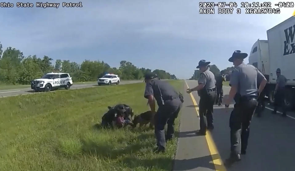 FILE - This image taken from police body cam video shows a police dog attacking Jadarrius Rose, 23, of Memphis, Tenn., on July 4, 2023, in Circleville, Ohio. For some, the scene of Rose being attacked by a police dog harkens back to the Civil Rights Movement, when authorities often turned dogs on peaceful Black protesters marching for equality. (Ohio State Highway Patrol via AP, File).