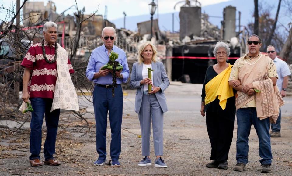 Joe and Jill Biden participate in a blessing ceremony as they visit areas devastated by the wildfires in Lahaina, on 21 August.