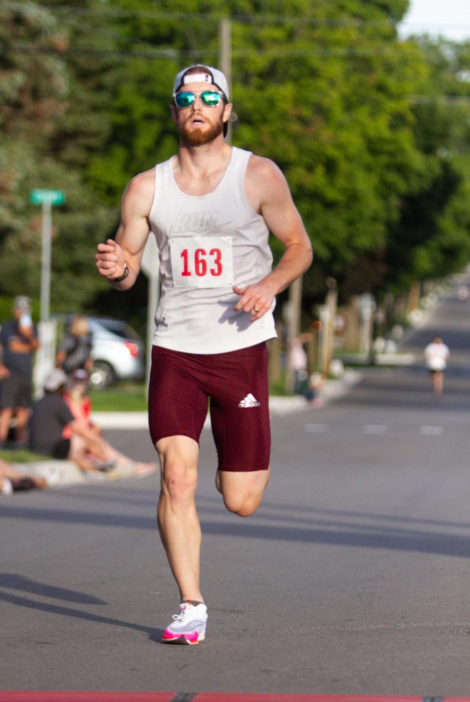 Clay Woll of Howell was first overall in the Howell Melon Run 5K with a time of 16:53 on Friday, Aug. 12, 2022.