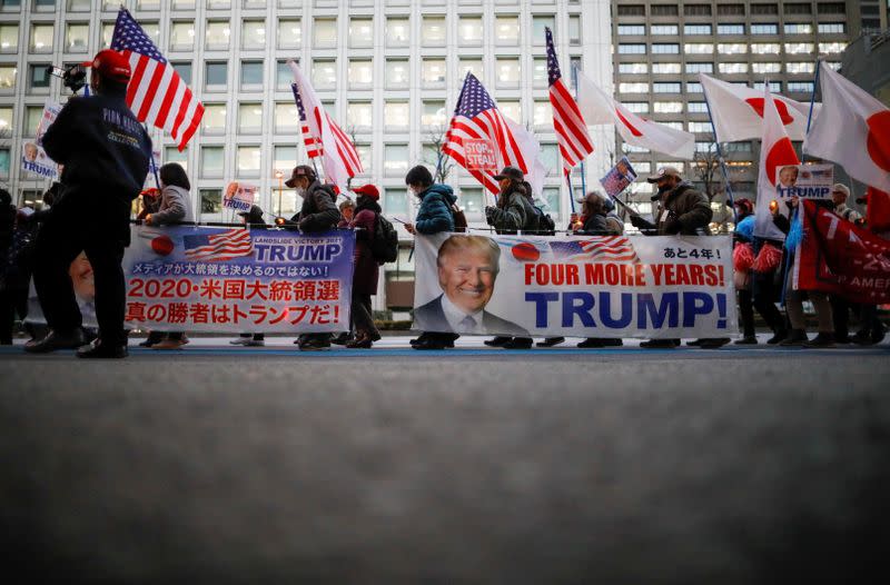 Supporters of U.S. President Donald Trump march ahead of the inauguration of President-elect Joe Biden, in Tokyo