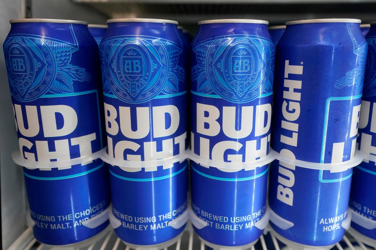 Cans of Bud Light chill in a refrigerator in Oakland, Calif., Friday, April 28, 2023. After more than two decades as America's best-selling beer, Bud Light has slipped into 14th place, after conservatives started a boycott of the brand after it employed a transgender influencer in its marketing.